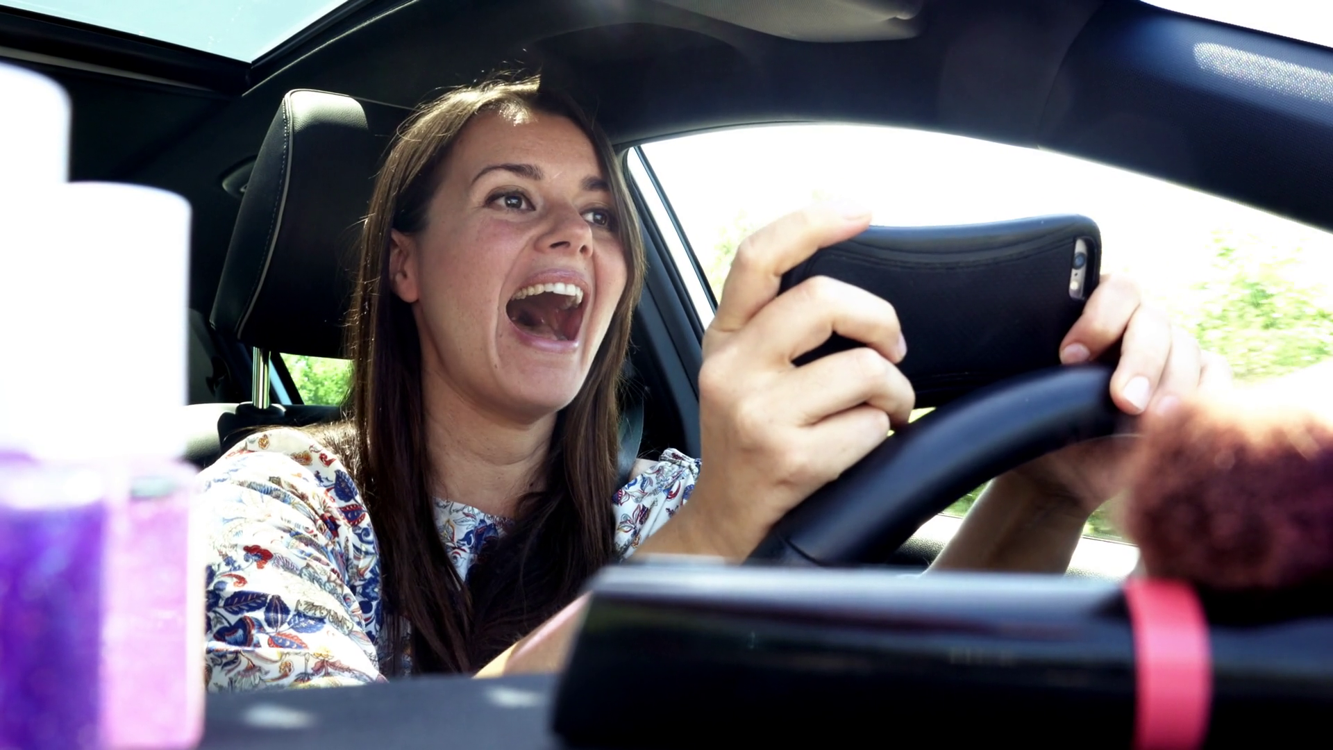 videoblocks-woman-texting-message-with-cell-phone-while-driving-car-dangerous_